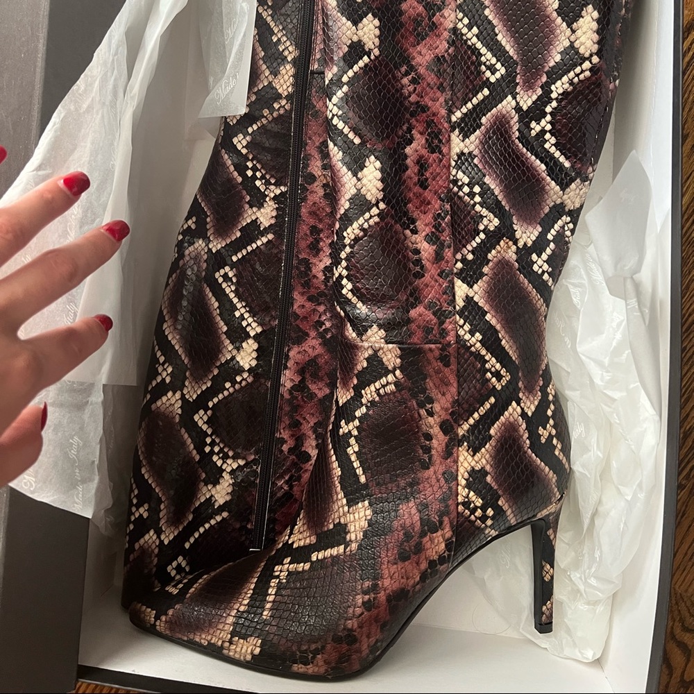 NEW! In a box! Real leather! Will fit 10! Smaller fit!